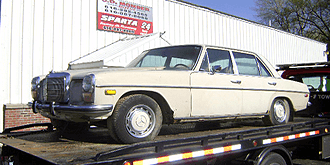 Mercedes on flatbed.