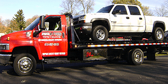 Sparta - A-1 Towing & Recovery - Pickup truck on flatbed.