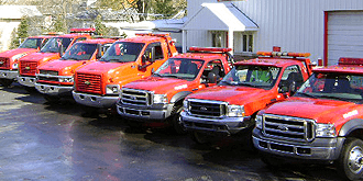 A-1 Towing & Recovery - Trucks in front of building.