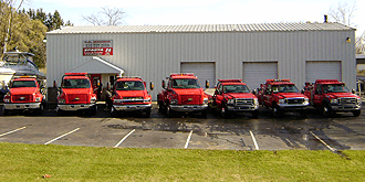 Trucks lined up in front of building.